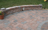 Finished patio showing outer knee walls with outdoor  speakers, low voltage lighting and placement for outdoor lights.